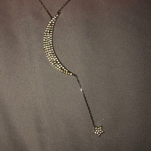 Moon with dangling star